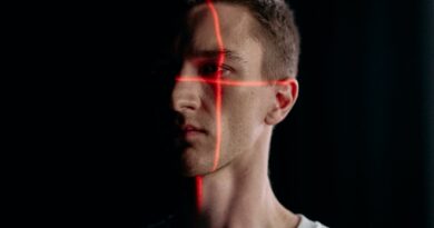 close up photo of man with laser lines on his face